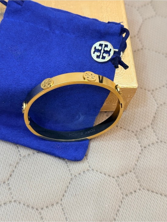 Tory Burch Jewelry - Tory Burch EUC Gold
Tone Miller Logo Stud Hinge
Bangle Bracelet with Dust
Bag